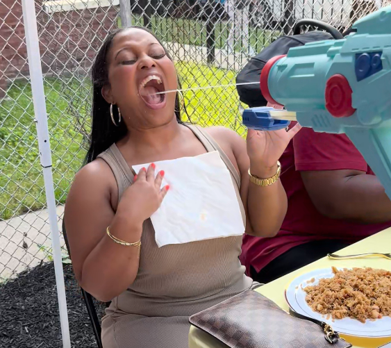 A tiny laptop in the palm of a hand